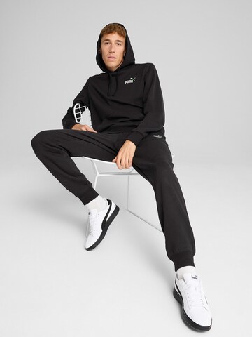 PUMA Sportsweatshirt 'ESS No. 1' in Schwarz