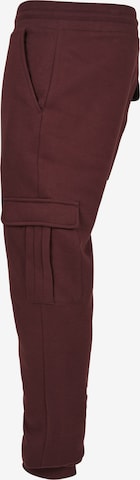 Tapered Pantaloni cargo di Urban Classics in rosso