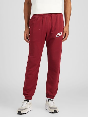 Nike Sportswear Tapered Housut värissä punainen: edessä