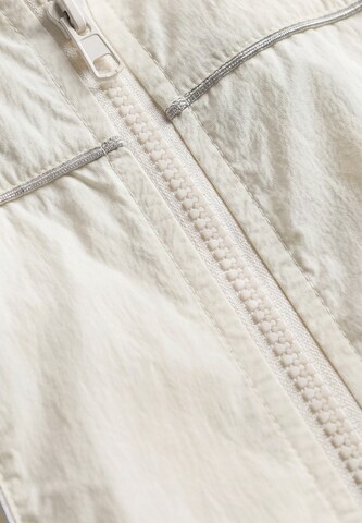 MO Tussenjas in Beige