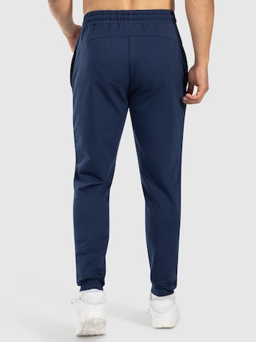 Effilé Pantalon de sport 'Nilo' Smilodox en bleu
