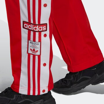 ADIDAS ORIGINALS Loose fit Trousers in Red