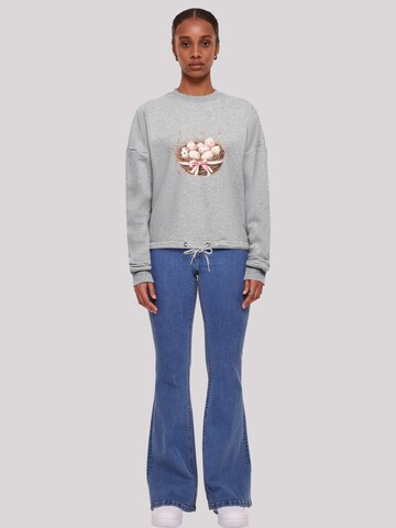 Sweat-shirt 'Osterei Nest Korb Dekor' F4NT4STIC en gris