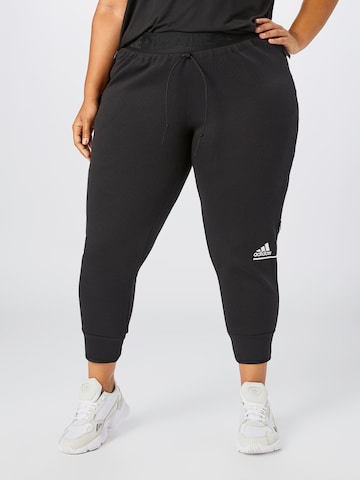 ADIDAS SPORTSWEAR Tapered Sportsbukser i sort: forside