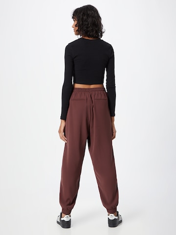 ABOUT YOU Loose fit Trousers 'Romina' in Brown