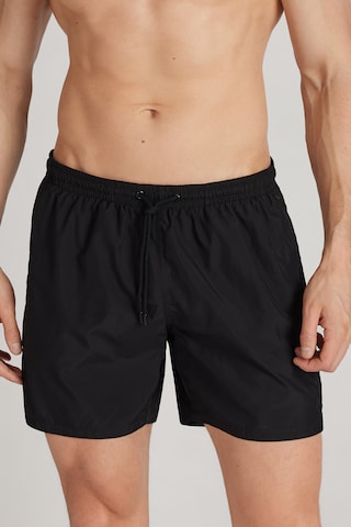 INTIMISSIMI Board Shorts in Black: front