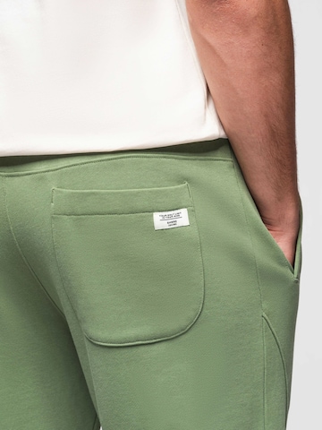 Effilé Pantalon de sport Ombre en vert