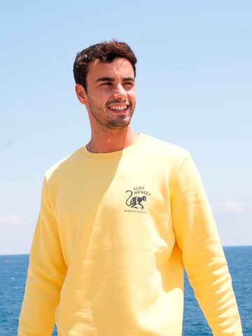 Surf Monkey - Sudadera 'Rette das Ozean' en amarillo