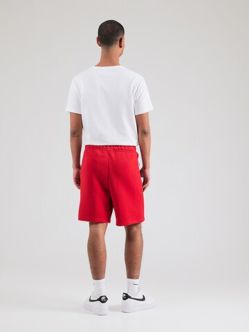 Loosefit Pantaloni 'TCH FLC' di Nike Sportswear in rosso