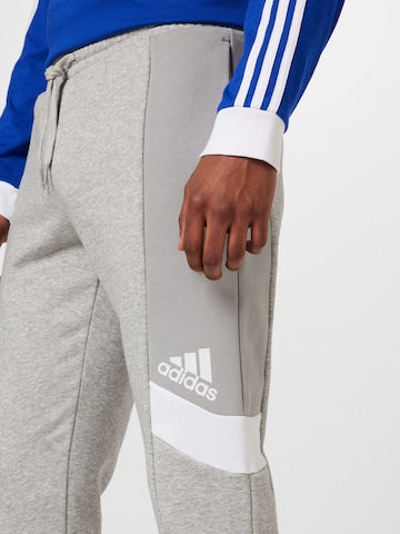 ADIDAS SPORTSWEAR Tapered Workout Pants 'Essentials Colorblock' in Grey