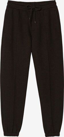 Bershka Tapered Trousers in Black: front