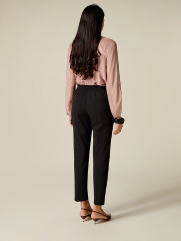 oltre - Skinny Pantalón en negro