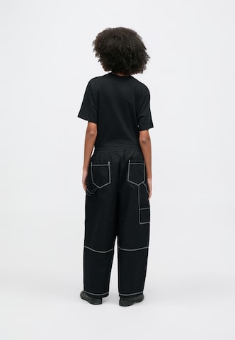 Largi Pantaloni 'STREET' de la Nike Sportswear pe negru