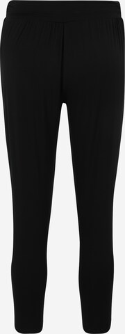 Slimfit Pantaloni sport de la CURARE Yogawear pe negru