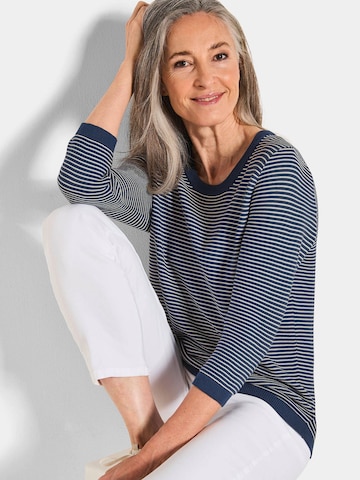 Goldner Pullover in Blau