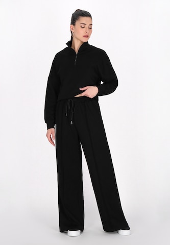 faina Athlsr - Loosefit Calças 'Fashion Look' em preto