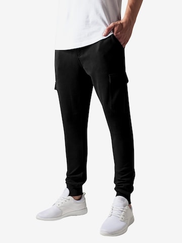 Urban Classics Tapered Cargo Pants in Black: front