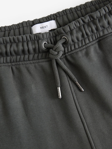 Tapered Pantaloni di Next in grigio