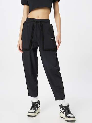 Nike Sportswear Tapered Trousers in Black: front