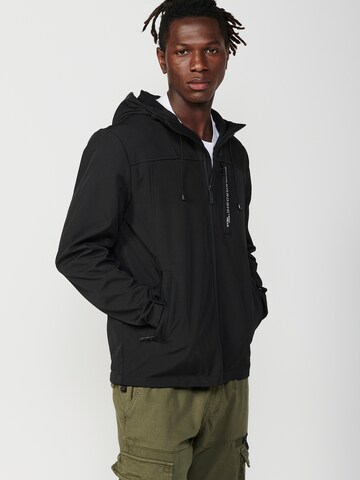 KOROSHI Välikausitakki värissä musta