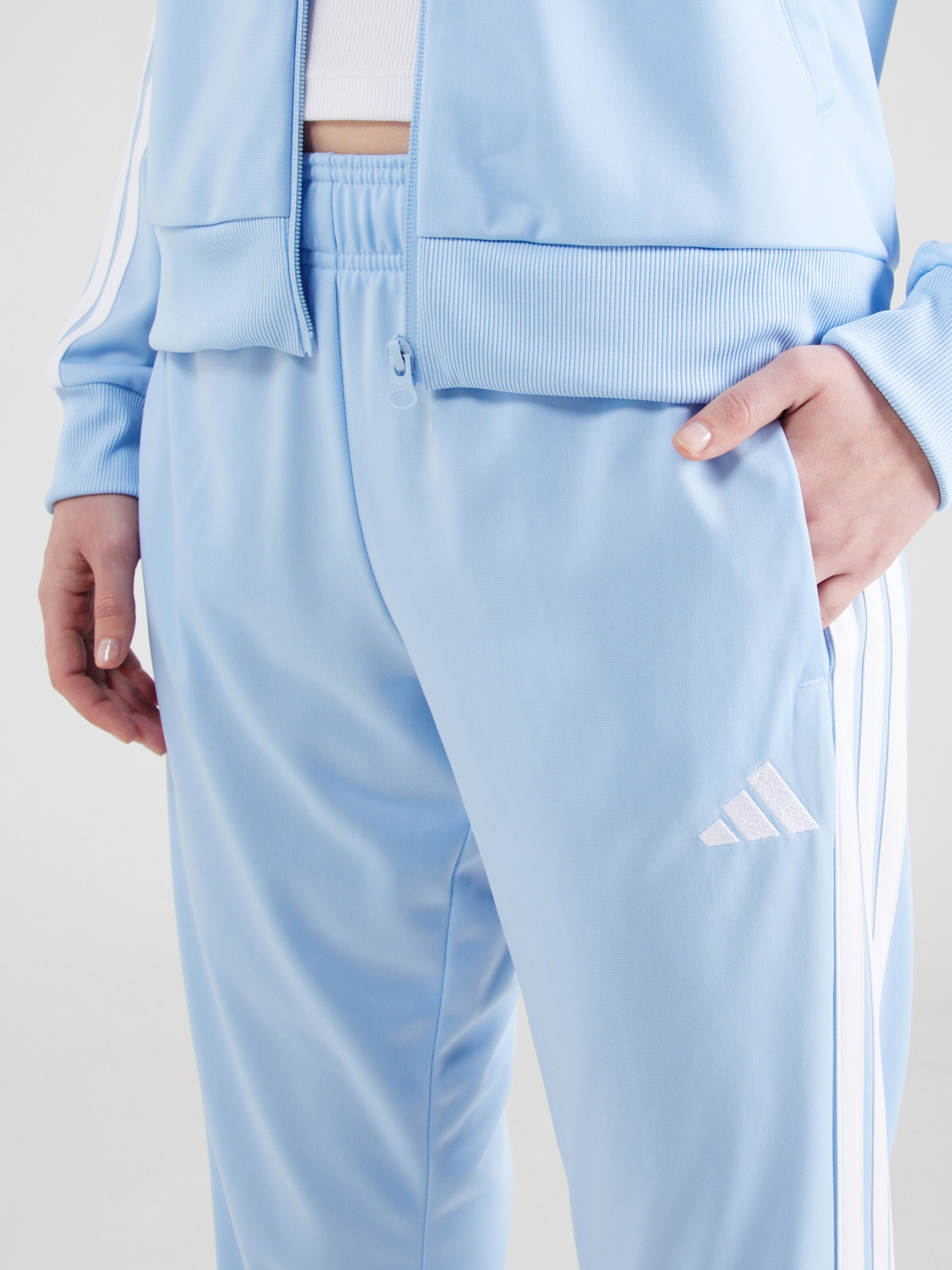 ADIDAS SPORTSWEAR Trainingspak 'Essentials' in Lichtblauw | ABOUT YOU