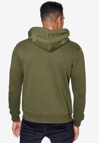 Rusty Neal Zip-Up Hoodie in Green