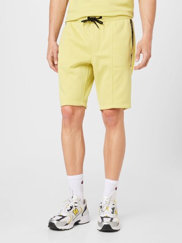 Calvin Klein Jeans Normalny krój Spodnie w kolorze żółty: przód
