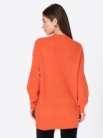 Noisy may Sweater in Orange