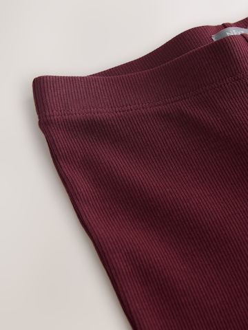 Next - Acampanado Leggings en rojo