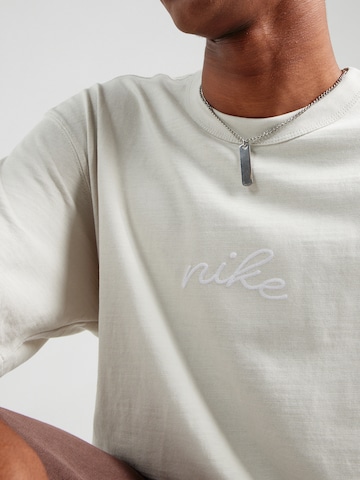 Tricou 'ESS' de la Nike Sportswear pe bej