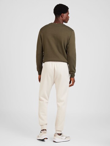 Champion Authentic Athletic Apparel - Tapered Pantalón en gris