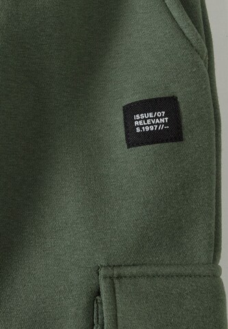 MINOTI Tapered Hose in Grün