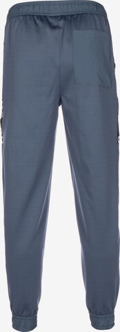 Effilé Pantalon de sport PUMA en bleu