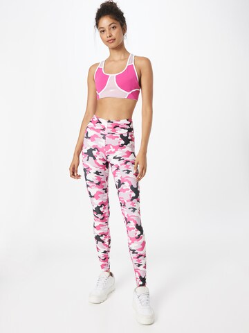 Skinny Pantaloni sportivi di Reebok in rosa