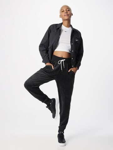 Nike Sportswear Tapered Pleat-front trousers in Black