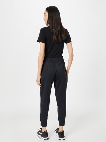 UNDER ARMOUR - Tapered Pantalón deportivo 'Meridian' en negro