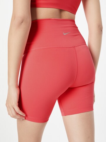 NIKE Skinny Spodnie sportowe w kolorze pomarańczowy