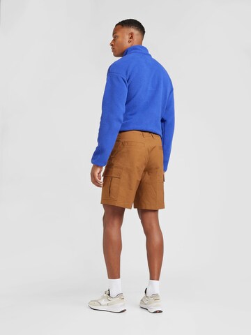 Nike Sportswear Normalny krój Bojówki 'CLUB' w kolorze brązowy