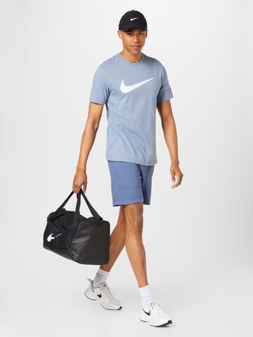 NIKE Regular Sports trousers in Blue