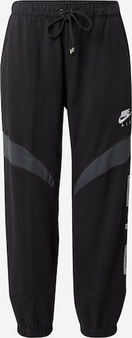 Nike Sportswear Tapered Pants in Black: front