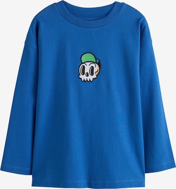 Next T-shirt i blå: framsida