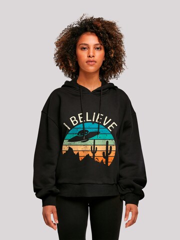 Sweat-shirt 'I Believe UFO Alien Sonnenuntergang' F4NT4STIC en noir : devant