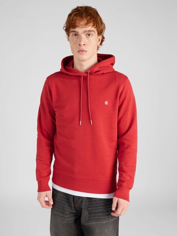 Sweat-shirt Calvin Klein Jeans en rouge : devant