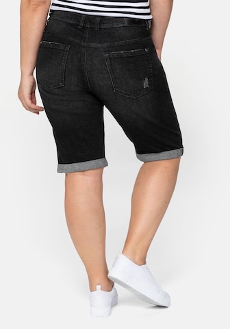 SHEEGO Slimfit Jeans i svart