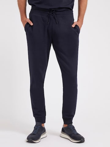 GUESS Tapered Pants in Blue: front