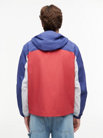 Tommy Jeans Tussenjas 'CHICAGO' in Rood