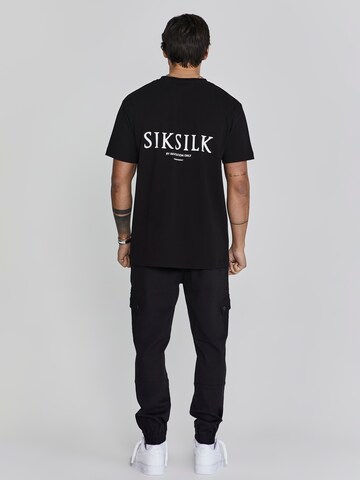 Tapered Pantaloni cargo di SikSilk in nero