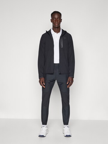 Sergio Tacchini Zwężany krój Spodnie sportowe 'Pelle' w kolorze czarny