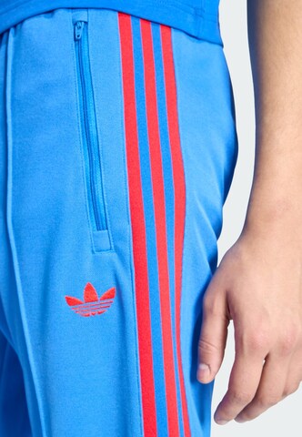 ADIDAS ORIGINALS Slimfit Sportbroek in Blauw
