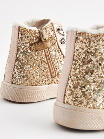 Baskets Next en or